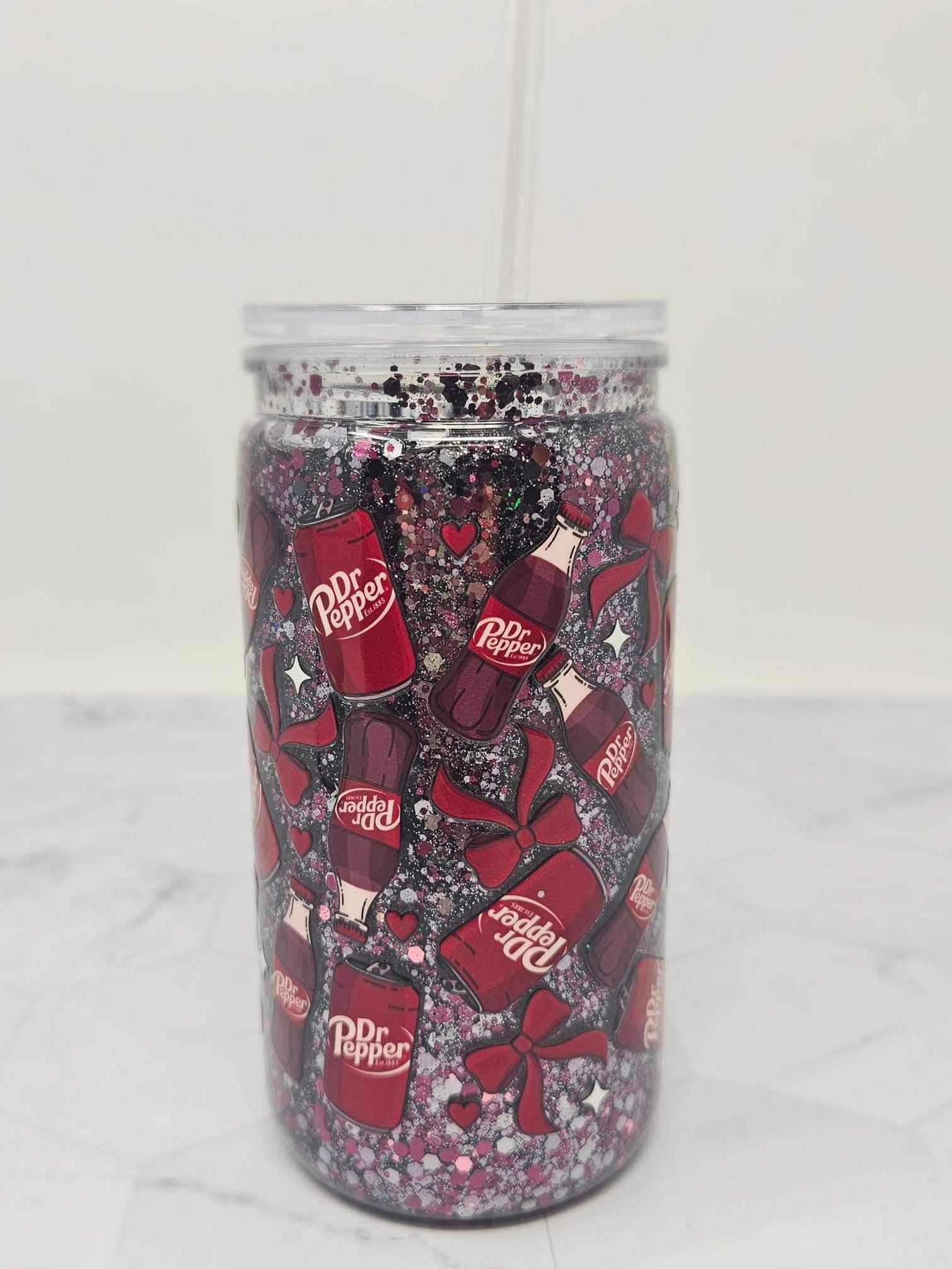 16 oz acrylic Snow Globe Tumbler with Dr. Pepper branding, glitter, and decorative bows