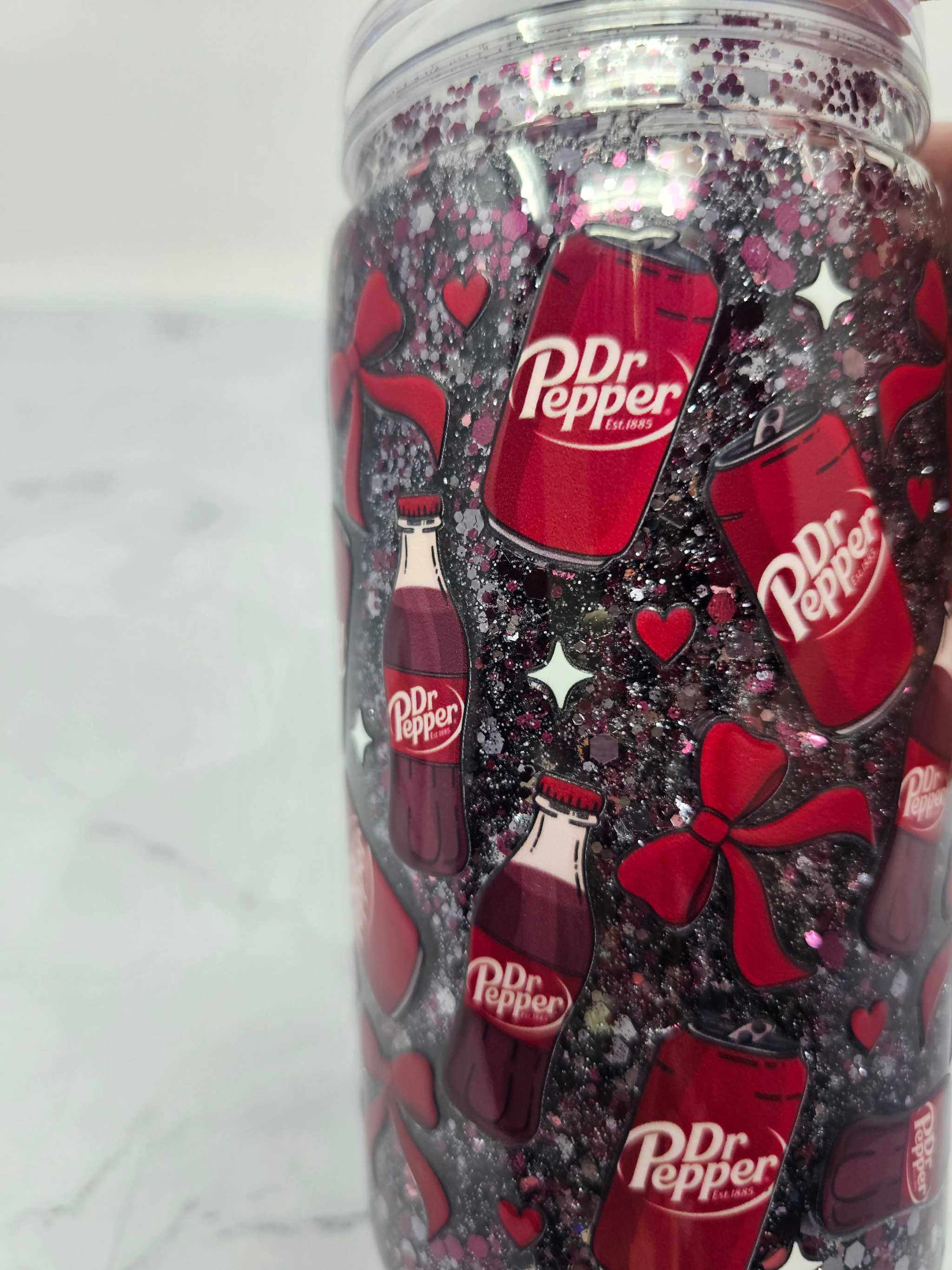16 oz acrylic Snow Globe Tumbler with Dr. Pepper glitter and decorative bows