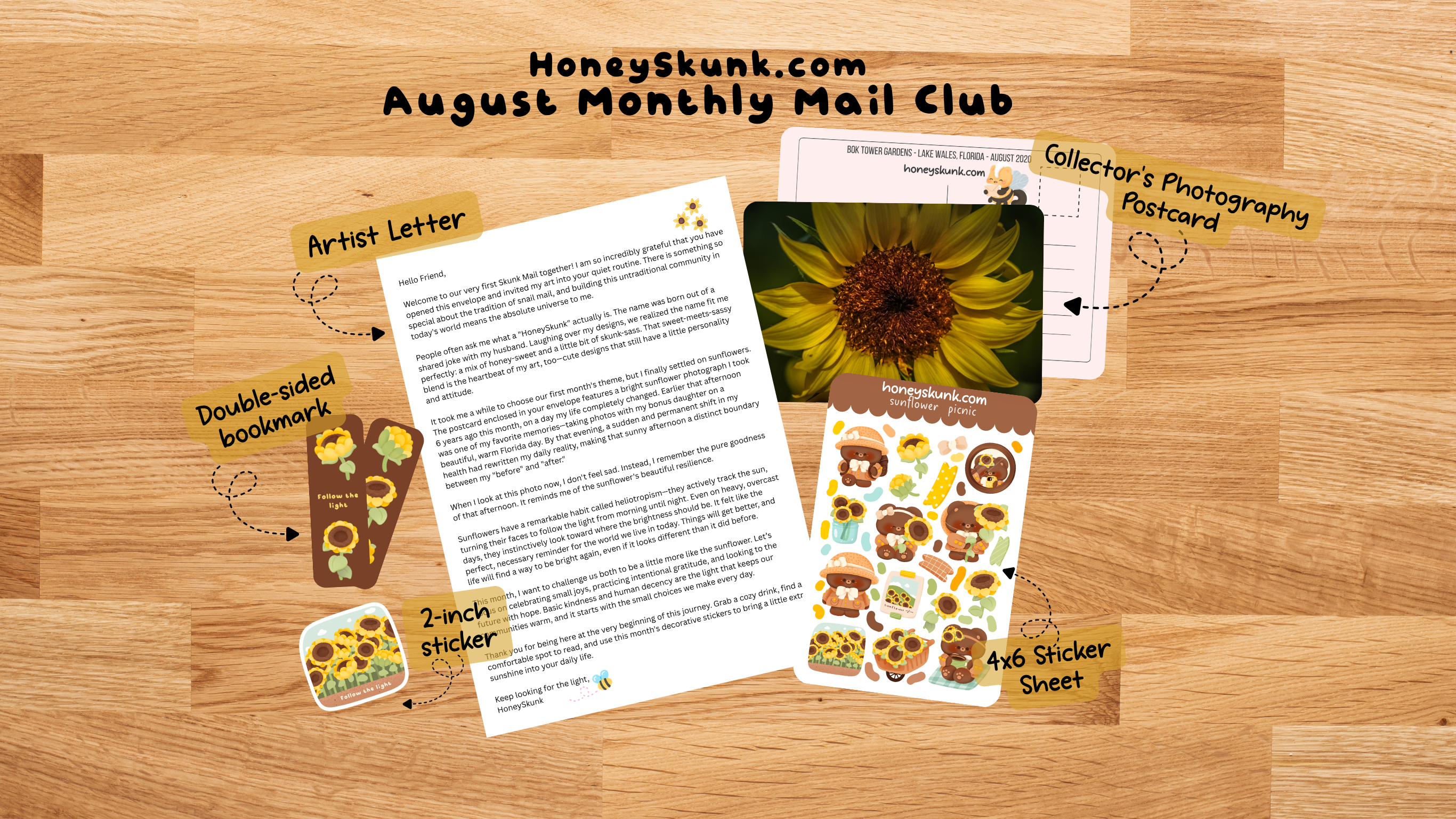 A flat-lay mockup of a Honeyskunk.com August Monthly Mail Club package on a light wood background.