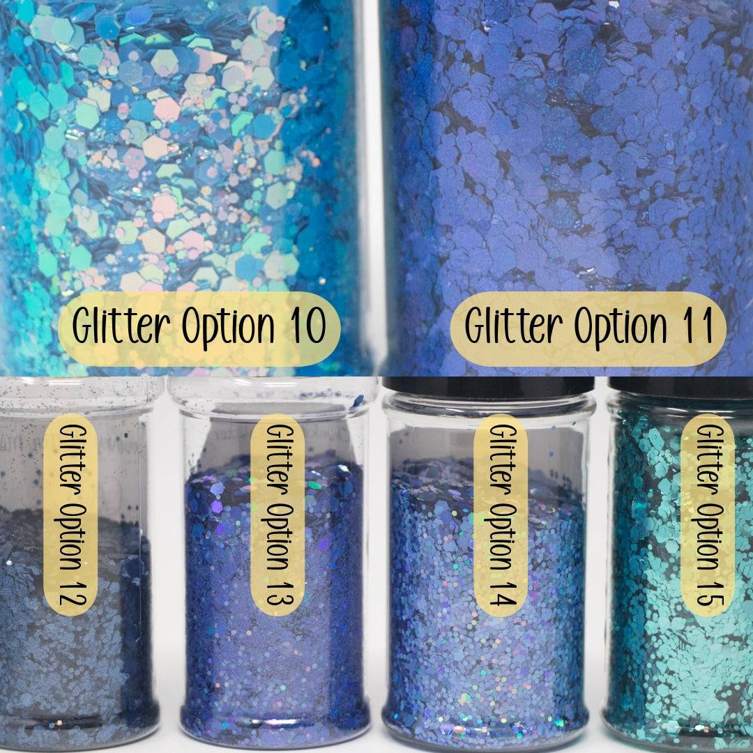 custom personalized snow globe tumbler with glitter and add-ons on display