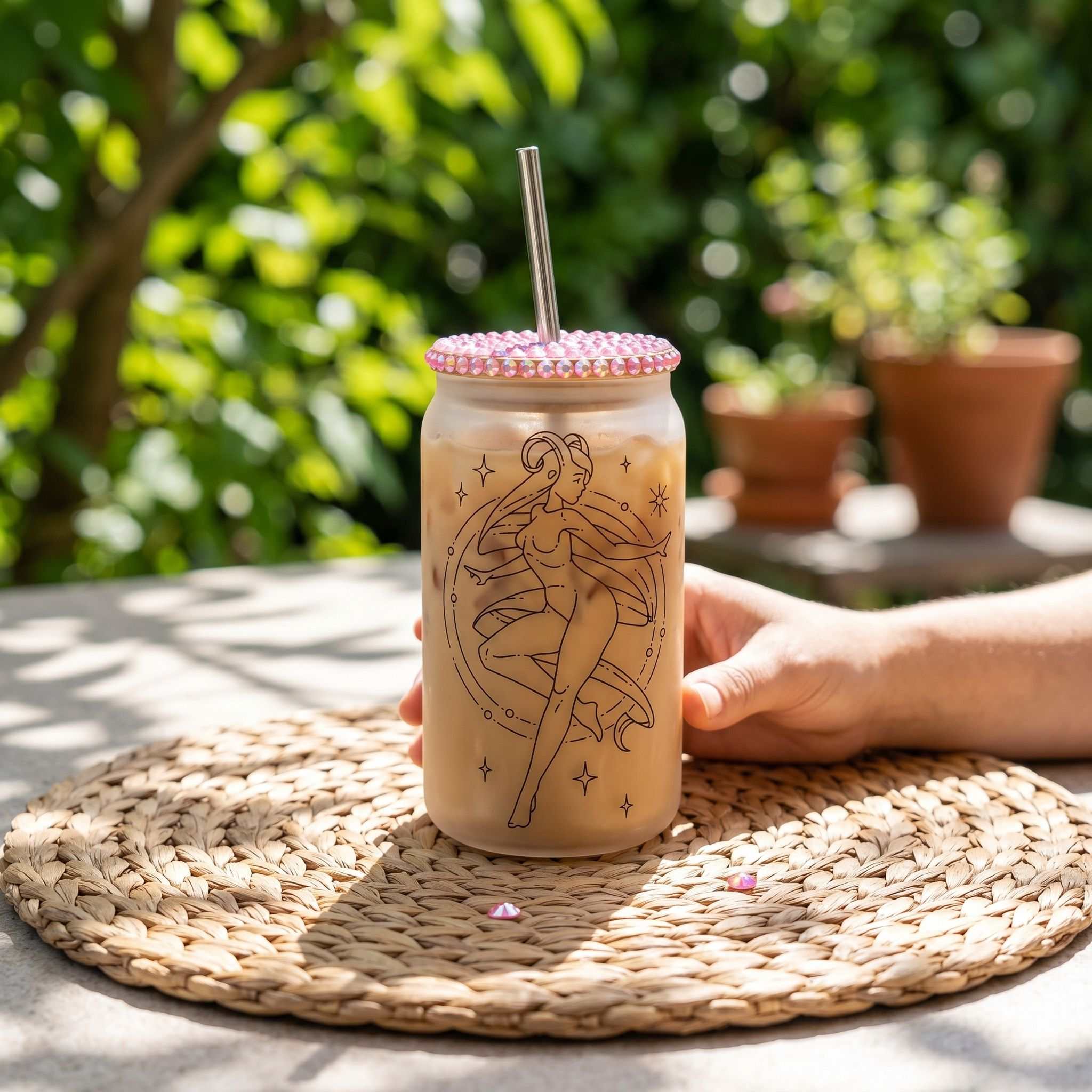 Full shot of Aries Zodiac Libby Glass Beer Can Cup on outdoor patio table with natural sunlight, casual and happy ambiance.