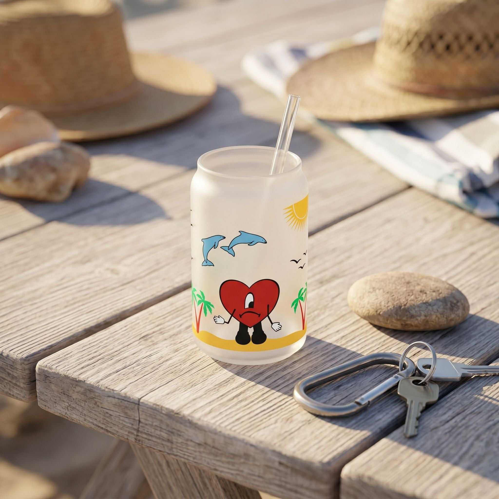 Close-up of 16oz Libby glass beer can cup inspired by Bad Bunny's album, sitting on wooden surface with natural light highlighting its design.
