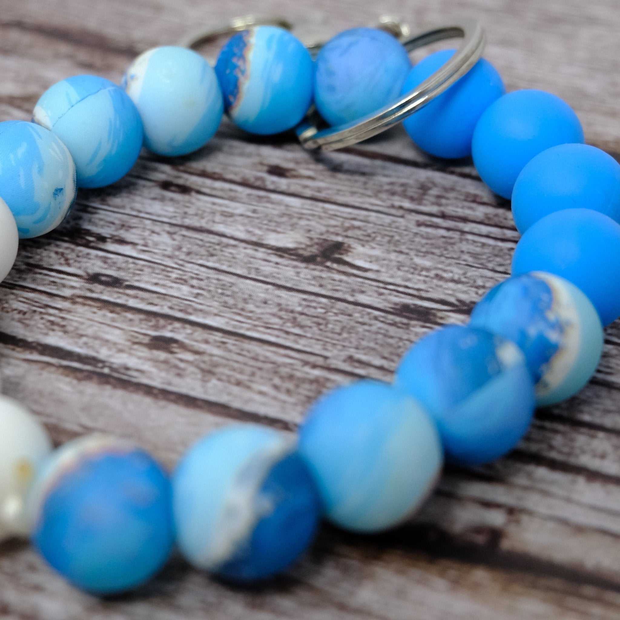 Blue Ocean Beaded Wristlet keychain with blue and white silicone beads and silver lobster clasp