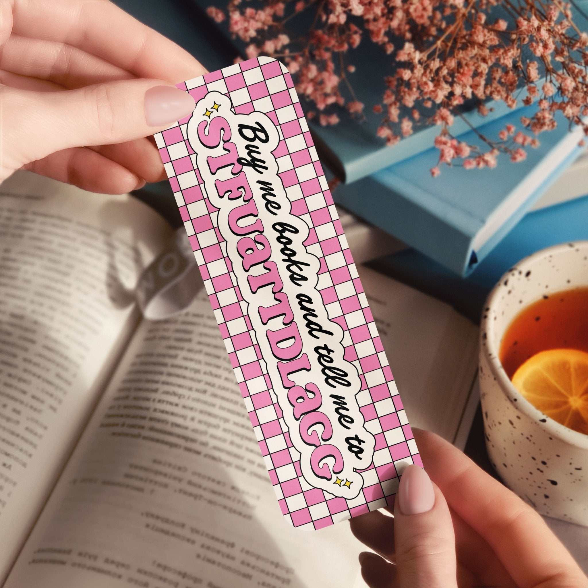 Buy Me Books bookmark with retro checkerboard and stars design in glossy, holographic rainbow, and broken glass finishes