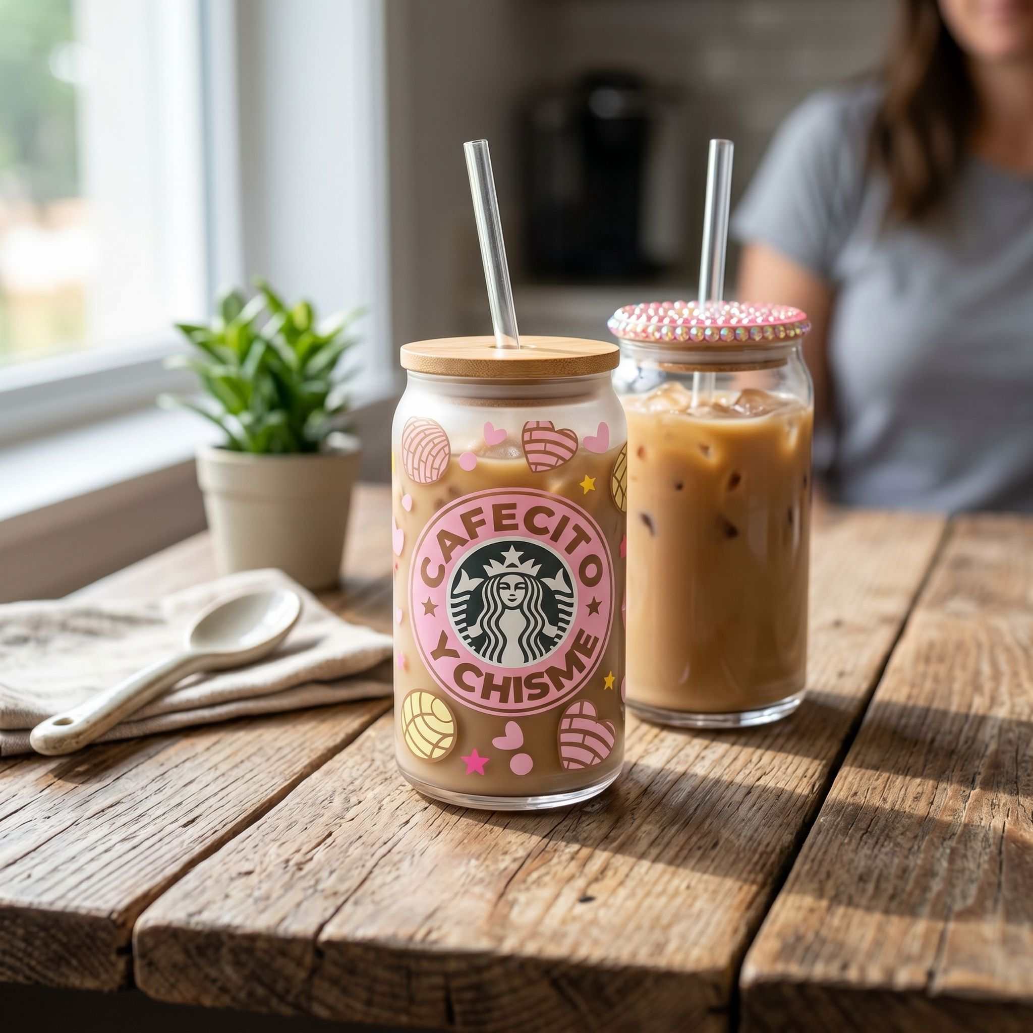 16 oz clear glass Libby can cup with Cafecito Y Chisme design on rustic wooden table, showcasing casual vibe and natural lighting.