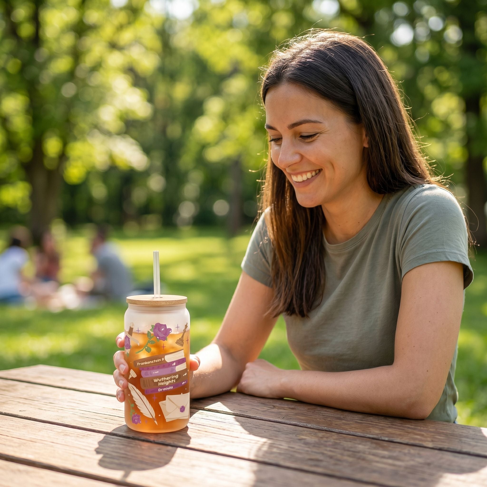 Close-up of clear 16oz Libby beer can glass highlighting the sublimated design and transparency, set on textured surface.