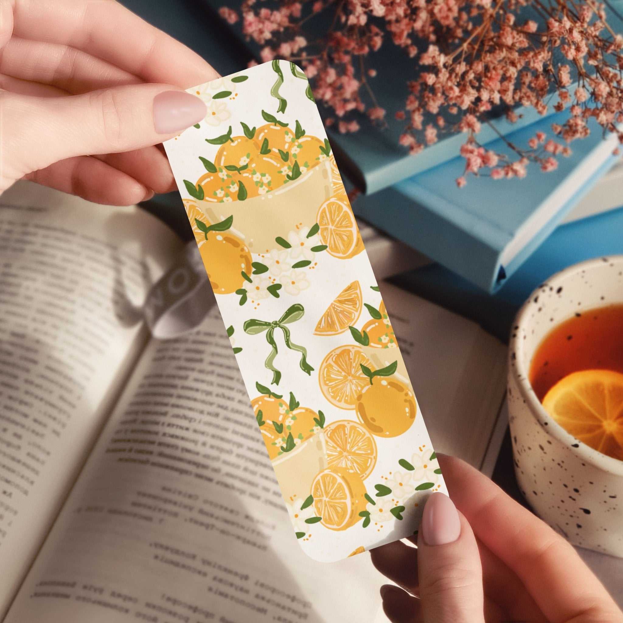 Bookmark with delicate bows, hand-drawn oranges, and orange blossoms in cottage core style