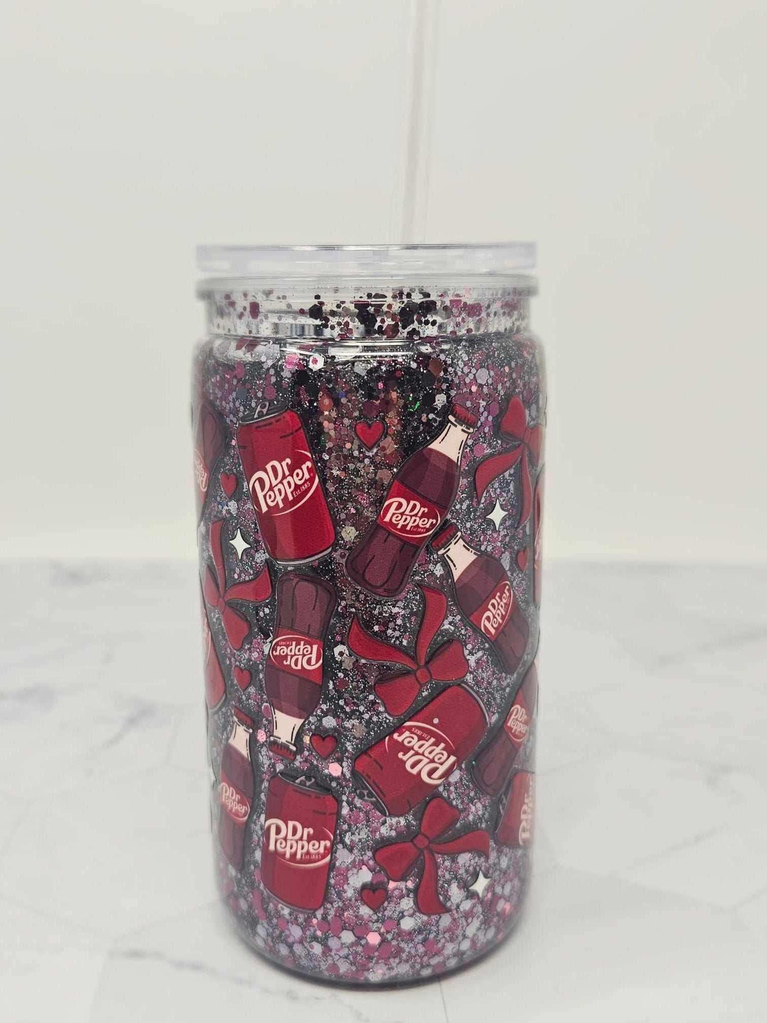 16 oz acrylic Snow Globe Tumbler with Dr. Pepper branding, glitter, and decorative bows