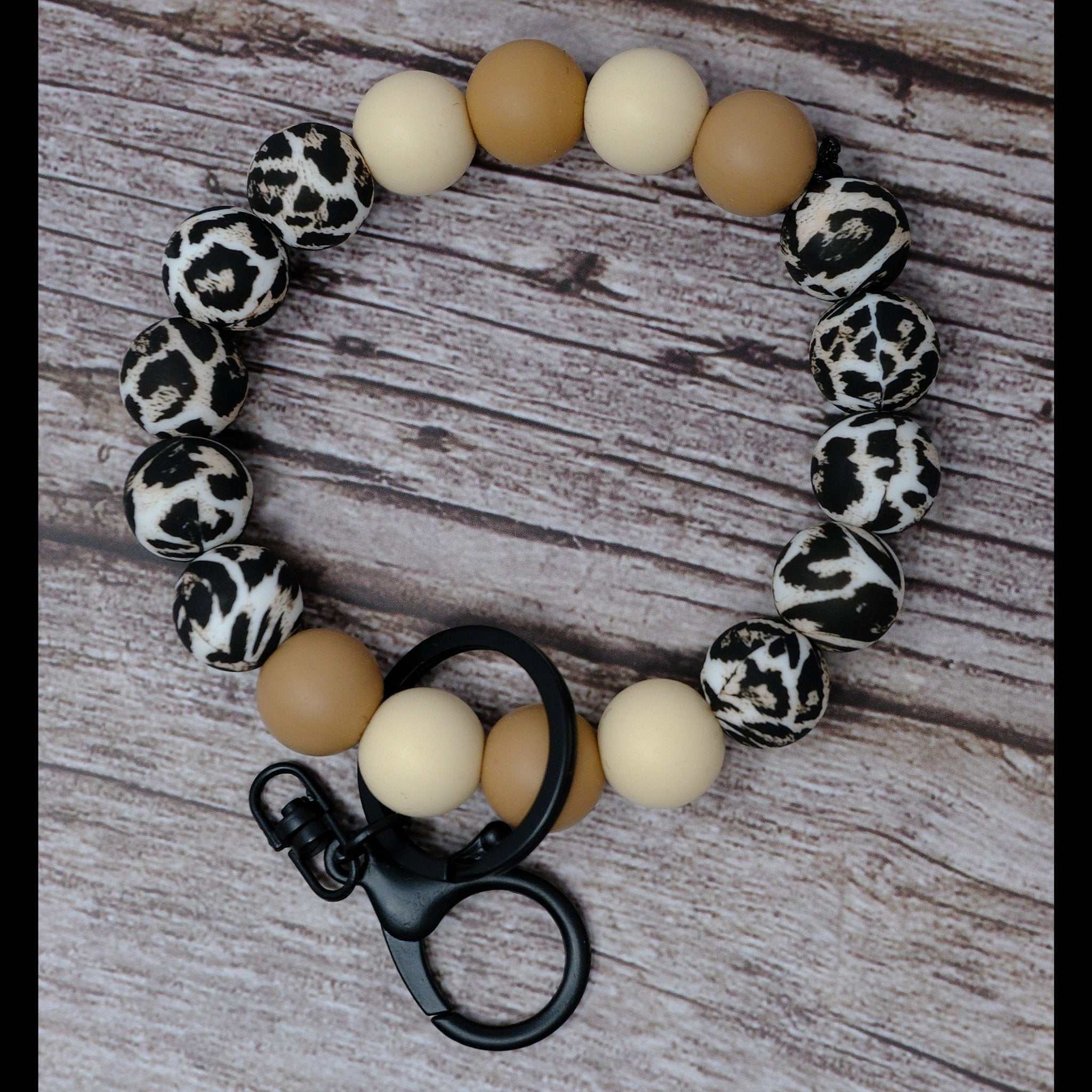 Leopard print wristlet keychain with tan and cream silicone beads and black lobster clasp
