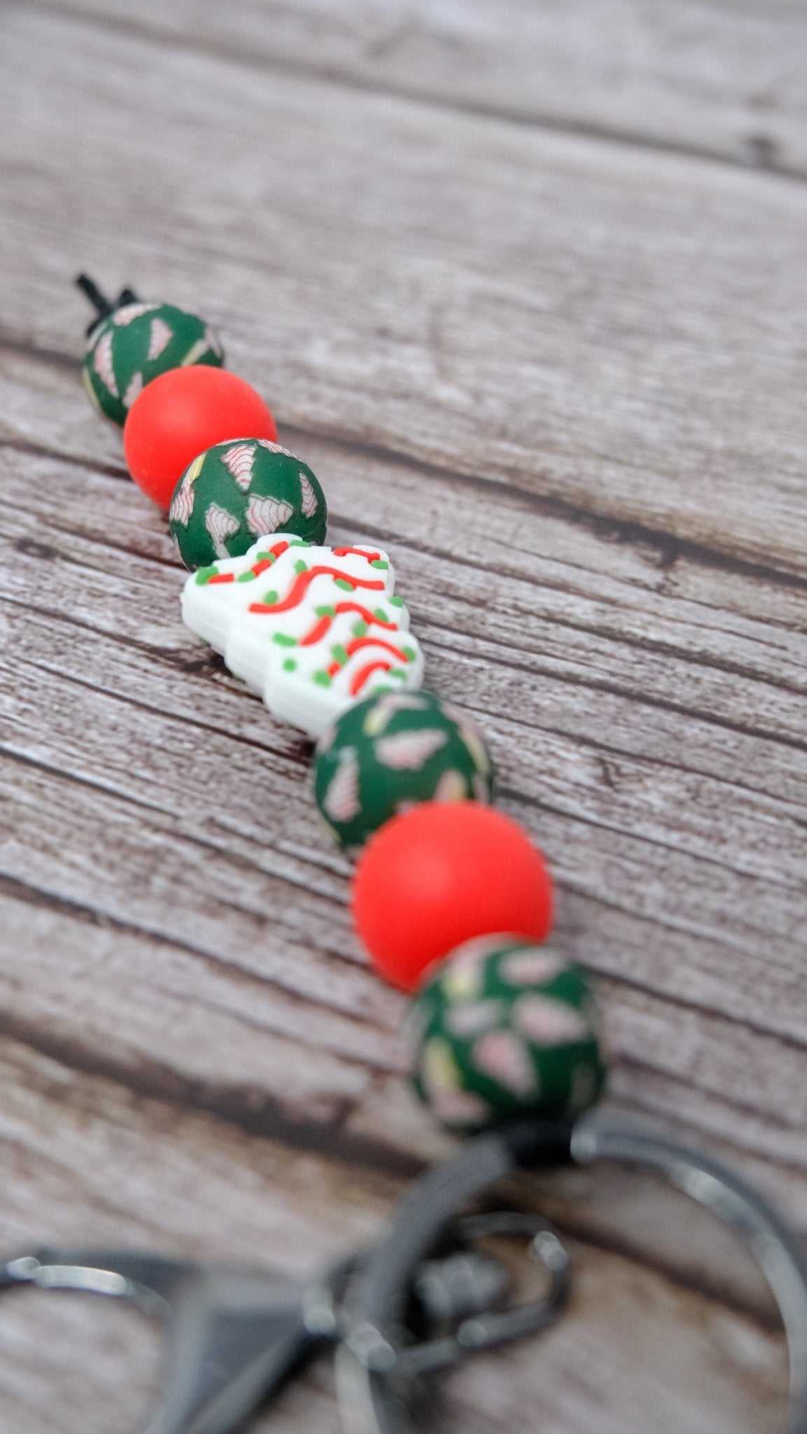 Little Debbie Christmas Tree silicone beaded keychain with red beads and silver lobster clasp
