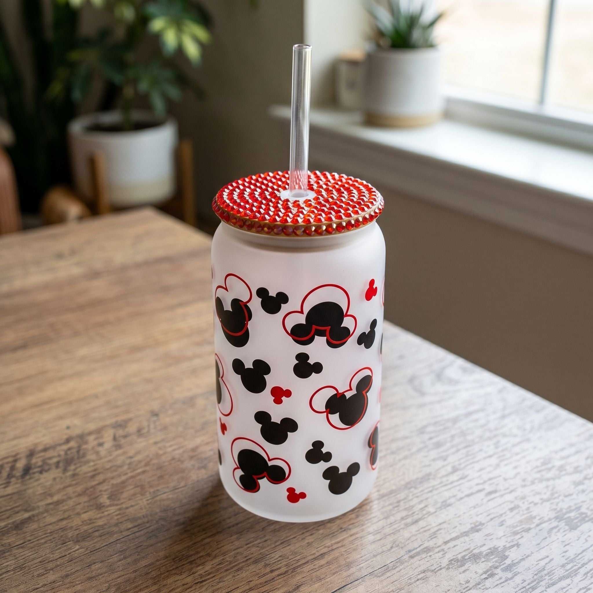16 oz Mickey Shapes Libby Glass beer can cup with red rhinestone bamboo lid, casual vibe, on wooden table with natural daylight