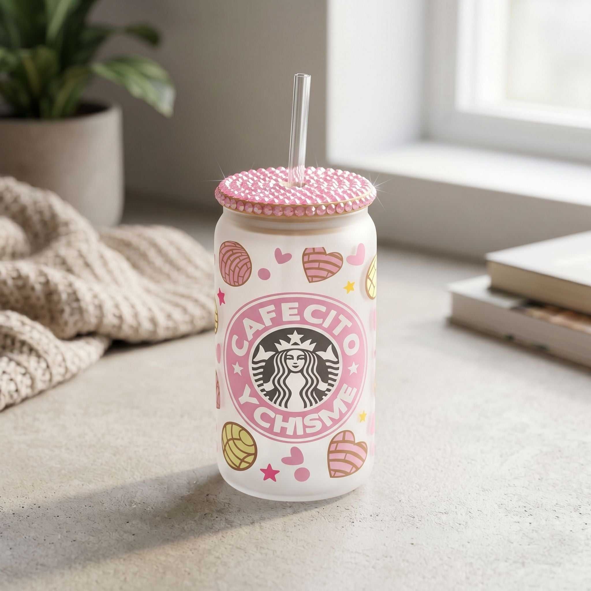 Small 16 oz glass tumbler with rhinestone bamboo lid on neutral surface, highlighting stylish detail and sparkling embellishments.