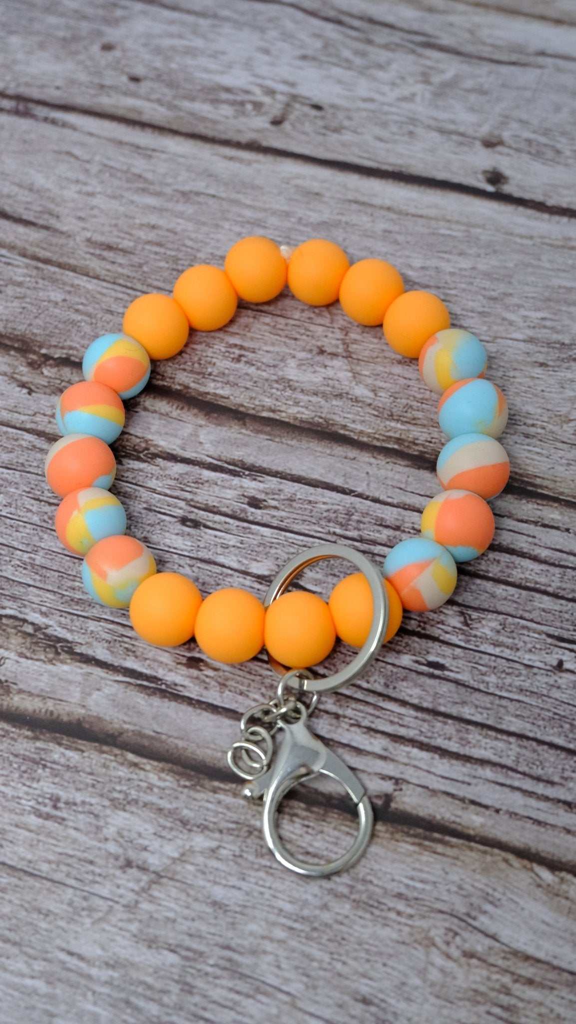 Tangerine colorful beaded wristlet keychain with silver lobster clasp and soft silicone beads