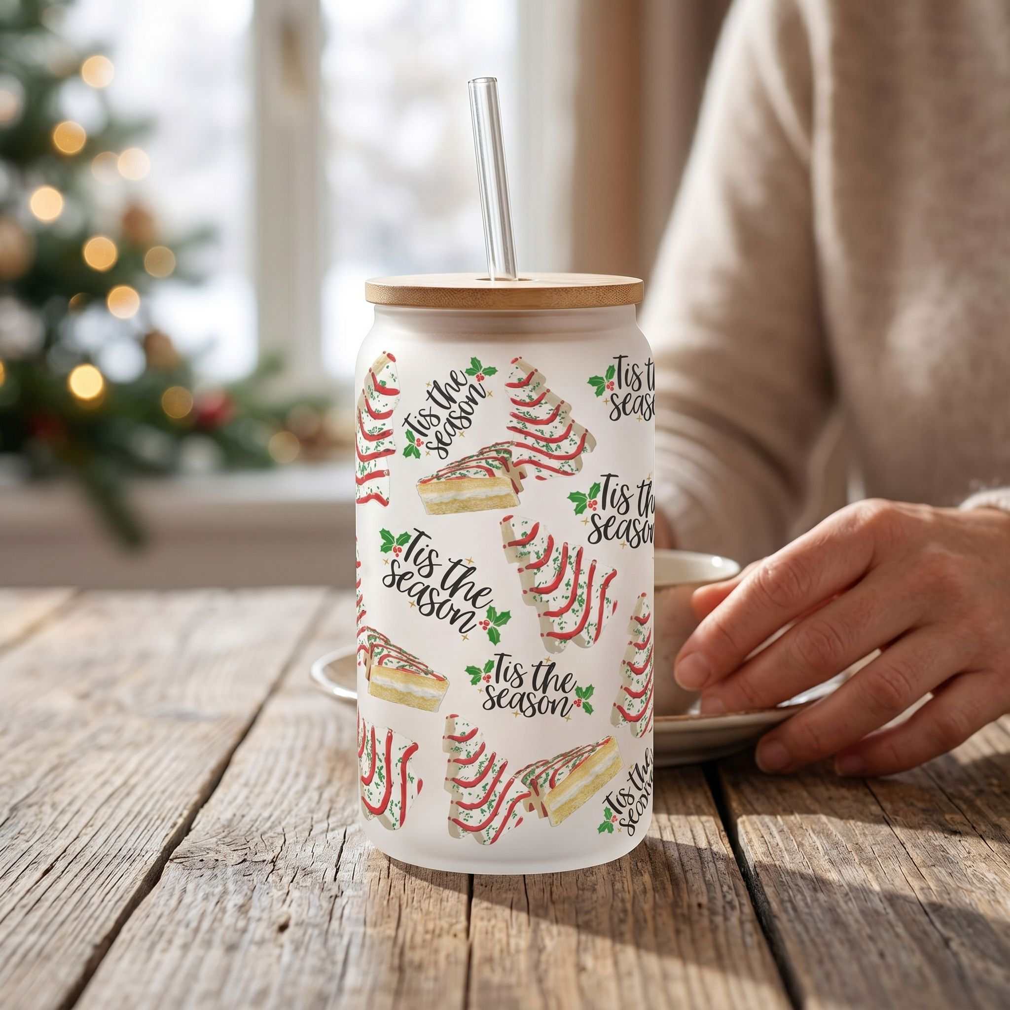 16 oz glass Libby beer can style cup with festive Christmas Tree design, perfect for holiday drinks in a cozy setting.