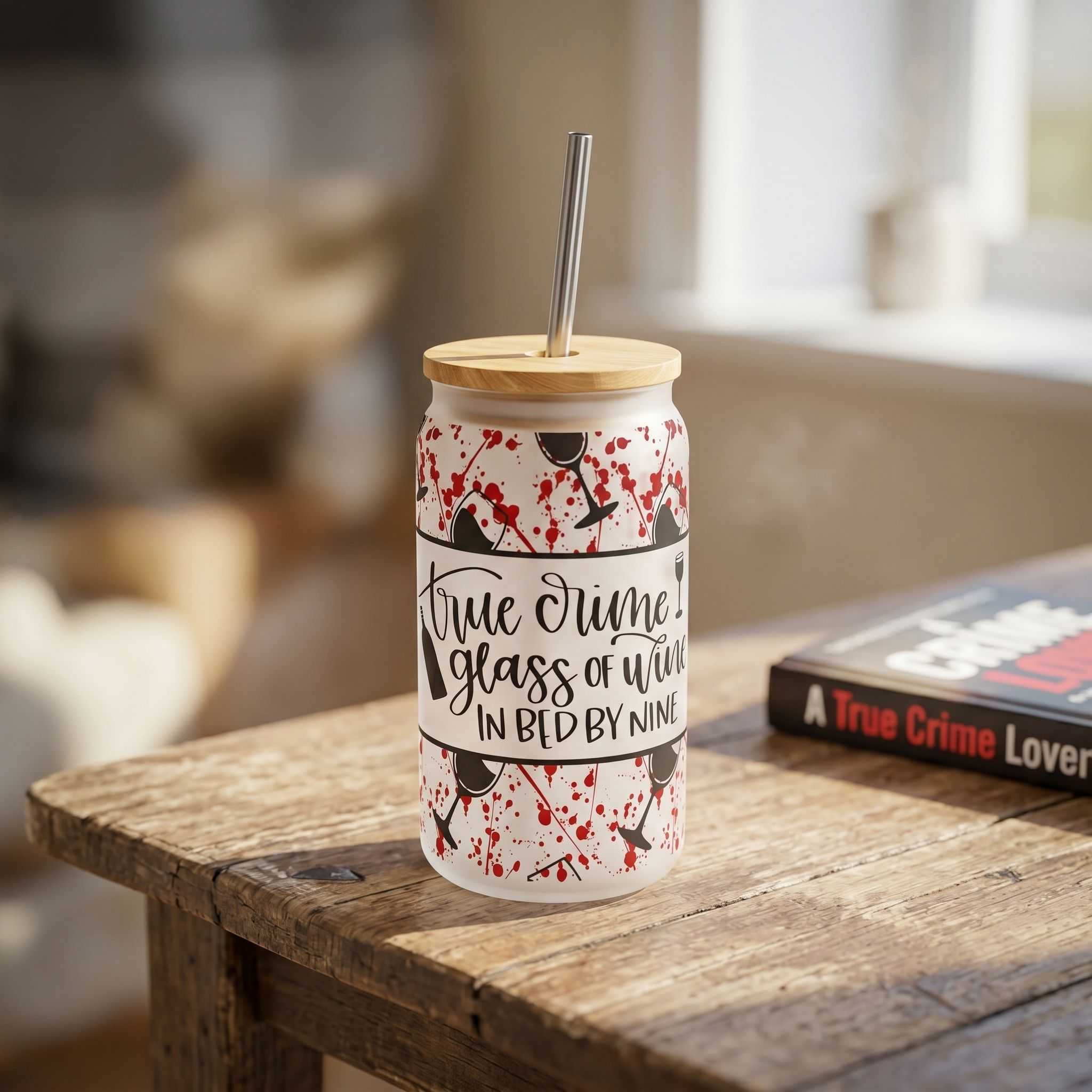 Close-up of 16 oz glass tumbler highlighting its transparency and sleek design on rustic wood.