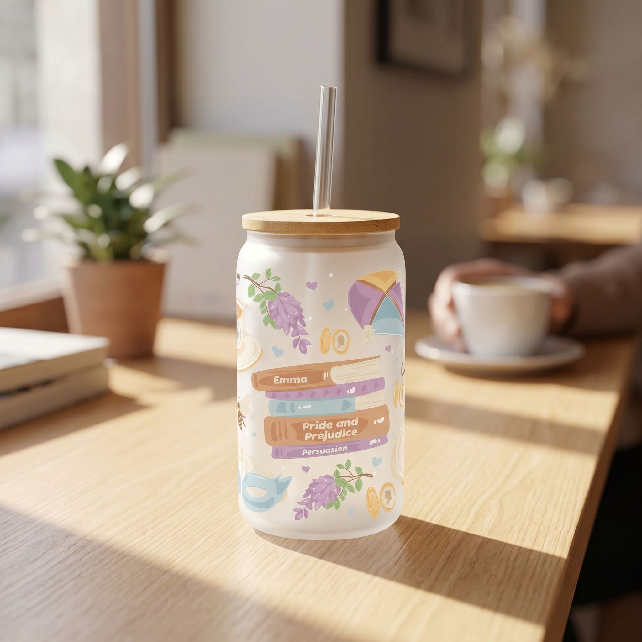 16 oz whimsical glass beer can cup with book lover design on a cozy cafe table with natural sunlight.